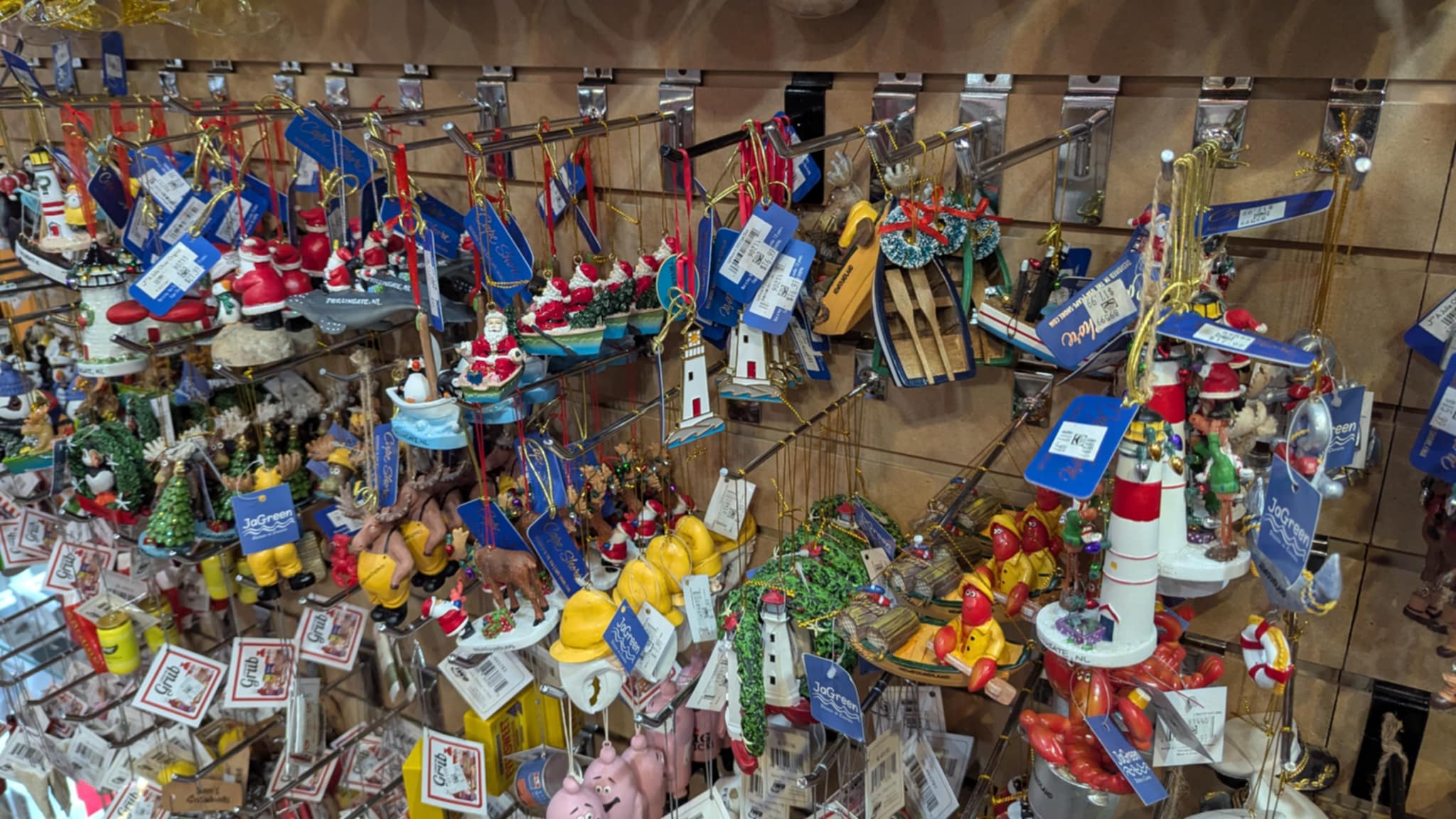 A wall of Newfoundland and Labrador Christmas ornaments and holiday decor in the Downhome Shoppe